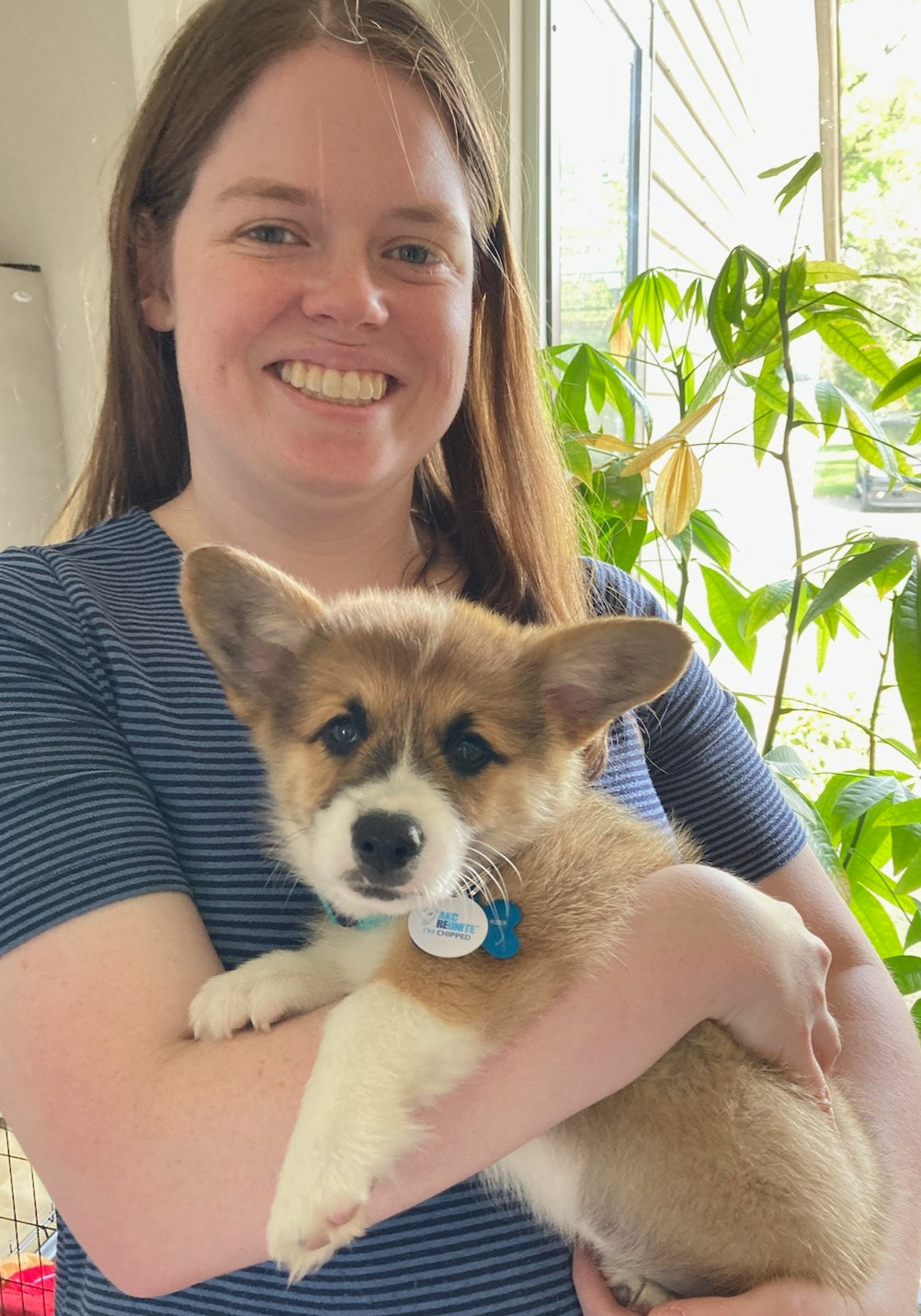 Hannah, holding her corgi Soonie when he was a puppy